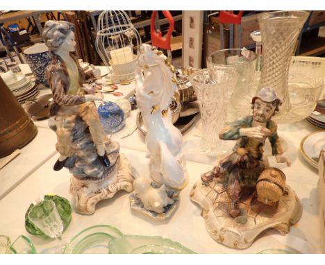 Two large Capodimonte figurines and a ceramic horse figure 