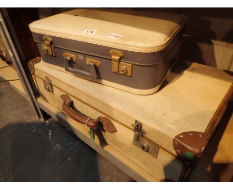 Cloth covered suitcase with leather trunk and crow foot military markings inside