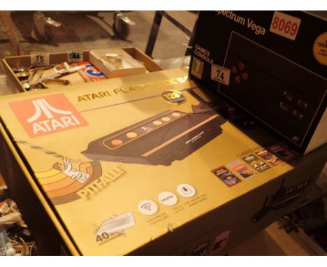 Atari Flashback 8 gold console and hand controls and a Sinclair ZS Spectrum  vega