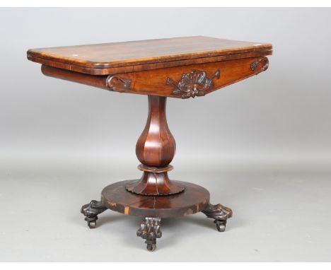 An early Victorian rosewood fold-over card table, raised on carved claw feet, height 73cm, width 91cm, depth 44cm.Buyer’s Pre