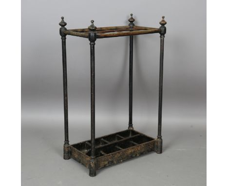 A late Victorian cast iron and brass eight-division stick stand of rectangular form, with turned finials and drip tray, heigh