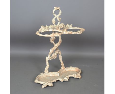 A Victorian style painted cast iron twin-division stick stand with removable tray, height 63cm, width 50cm.Buyer’s Premium 29