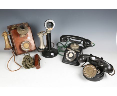A group of four early 20th century telephones, including a mahogany wall-mounted G.P.O., No. 121, and a candlestick telephone