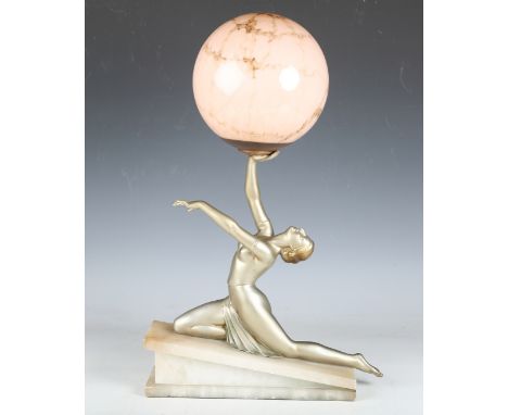 An Art Deco silvered cast spelter figural table lamp, modelled as a semi-nude lady balancing a spherical glass shade, raised 