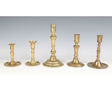 A 17th century German brass candlestick of turned form, height 13.5cm, another similar and three further 18th century brass c