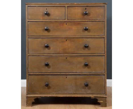 A Victorian pine green painted chest of two short and four long drawers with turned knob handles and standing on bracket feet