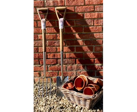 A Joseph Bentley stainless steel garden spade and fork set, 100cm high, together with a selection of modern terracotta plant 
