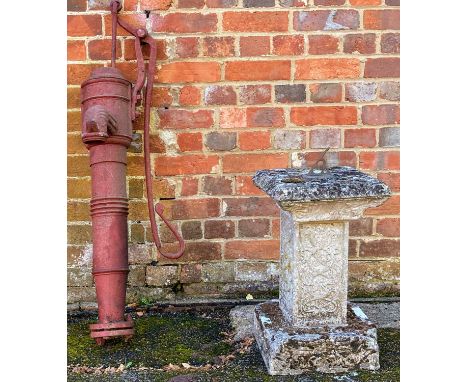 A cast reconstituted stone sundial with brass gnomon, 31cm to the top and 60cm high overall together with a Victorian red pai