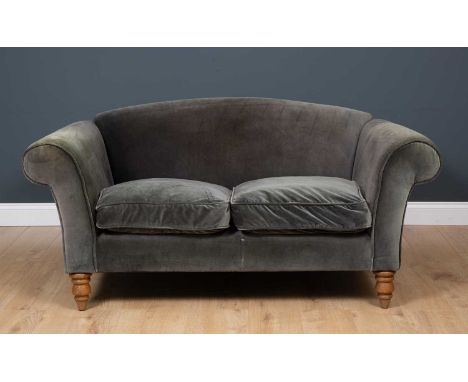 A contemporary two seater grey upholstered sofa with turned tapering oak front legs, approximately 150cm wide x 90cm deep x 7