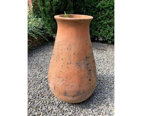 A terracotta garden planter of baluster form, 50cm diameter x 95cm highCondition report: In weathered condition, with minor m
