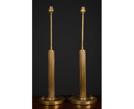 A pair of circular brass table lamps with fluted columns and circular bases, 59cm high to the light fittingCondition report: 