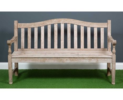 A 'Barlow Tyne' wooden one and a half seater garden bench with slatted seat back and seat and turned armrest supports, 144cm 