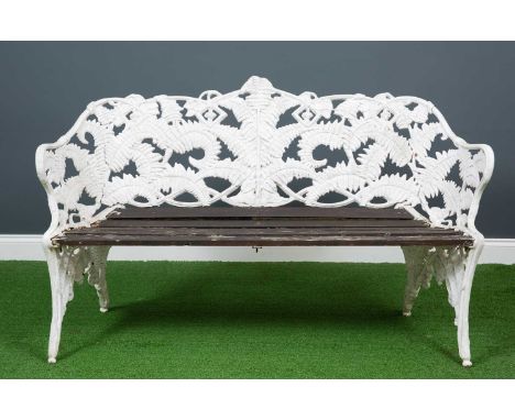 A white painted fern and blackberry pattern garden bench, the tub back frame enclosing a slatted wooden seat, 142cm wide x 44