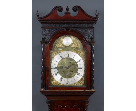 An early 19th century eight-day longcase clock by Daniel Brown of Glasgow, the mahogany case with swan neck pediment, blind f