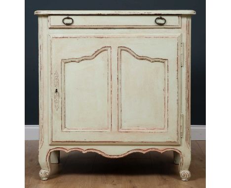 An 18th century French green painted buffet, the single drawer over a cupboard with fitted shelf on ogee bracket feet, 95cm w