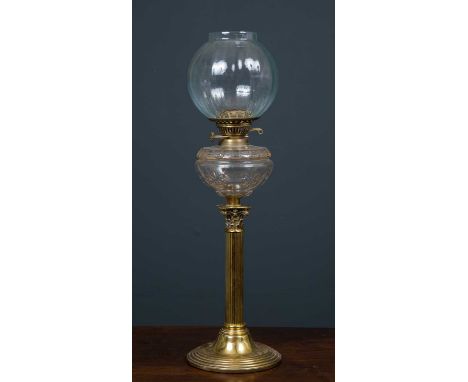 A 19th century brass oil lamp converted to a table lamp, the glass body beneath sphere top supported by a fluted Corinthian c