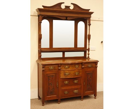 Edwardian walnut sideboard, shaped and carved pediment, two turned and fluted columns, three piece bevel edged mirror back, o