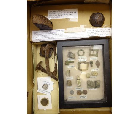 Metal detector finds from the Civil War period including shoe buckles, pipe tamper, musket balls, powder flask caps in glazed