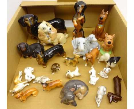 Royal Copenhagen Dachshund no. 3140, Royal Doulton Corgi and Dachshund, Beswick Boxer dog, Wade and other ceramic dog models 