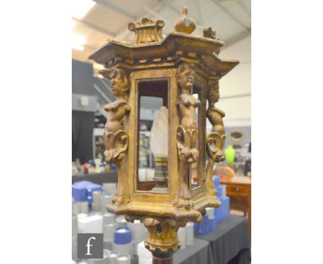 A gilt and red painted standard lamp, the hexagonal lantern section with caryatids beneath a stepped cornice, height 182cm, S