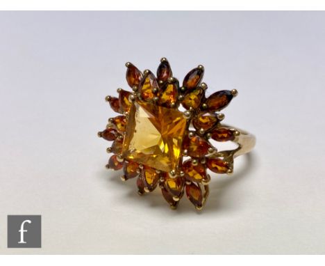 A 9ct citrene cluster ring with central square cut citrene within a pear and marquise cut border, weight 5.3g, ring size R. 