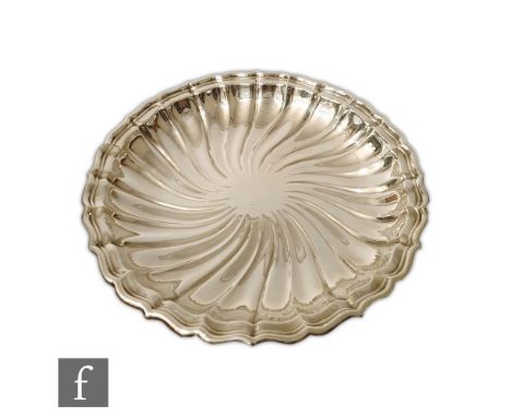 A large early 20th Century American sterling silver dish by Gorham, of wrythen fluted circular form with a fluted rim, stampe