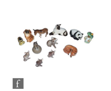 A collection of assorted Beswick animals to include a Pekinese model 1059, a Fox model 1017, a Koala Bear and a Siamese cat m