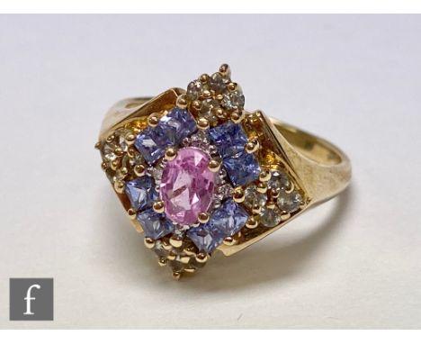 A 9ct hallmarked sapphire cluster ring comprising pink, blue and yellow sapphires to an off set square head, weight 4.5g, rin