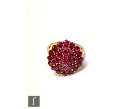 A 9ct gold ruby cluster ring, with a series of stones set in large flowerhead form, weight 4.8g, ring size S. 