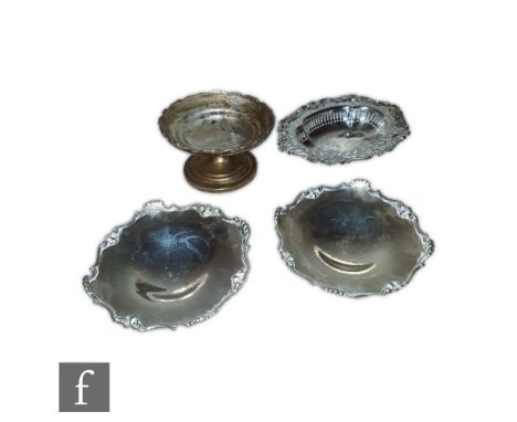 A collection of silver hallmarked items to include a pair of dishes of circular swept form, Birmingham 1928, Walker and Hall,