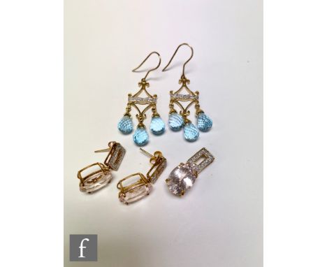 A pair of 9ct hallmarked blue topaz and diamond chandelier earrings with four diamond set above three faceted pear shaped top