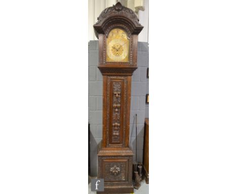 A 19th Century carved oak long case clock with three train movement the dial with three subsidiary dials Strike/silent, Chime