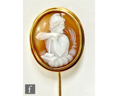A 19th Century Italian shell cameo carved with an image of Thor and his hammer amongst clouds, mounted to an 18ct gold stickp
