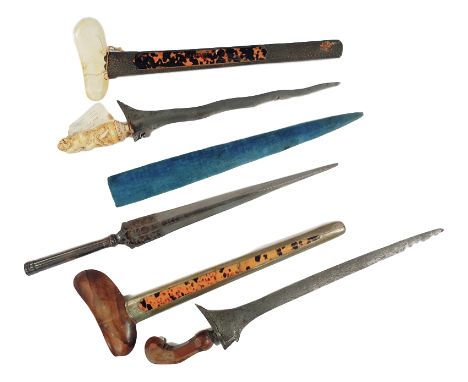 A late 19th Century Sumatra Kris with carved ivory handle in the form of a demon over a plain hilt tortoiseshell and silver m