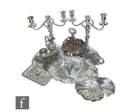A parcel lot of assorted silver plated items to include a pair of three light candelabras, a salver, a swing basket etc. (qty