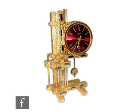 A late 20th Century German brass modernist mantle clock by Maritime with eight day striking movement, circular red enameled d