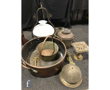 A collection of late 19th to early 20th Century brass wares to include a large twin handled pan, height 24cm and measuring 70