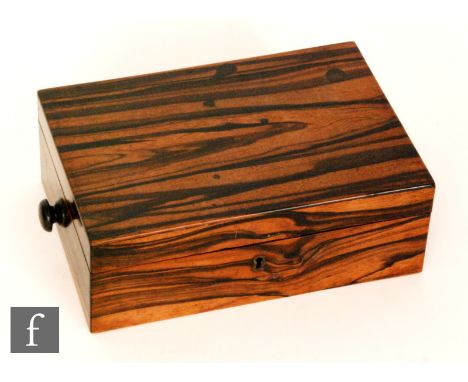 A 19th Century colonial coromandel work box, fitted with a tray interior containing compartments and a bobbin, width 28cm. 
