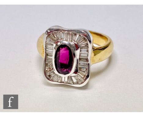 An 18ct ruby and diamond cluster ring, central oval collar set ruby, length 8mm, within a diamond baguette cut border, weight