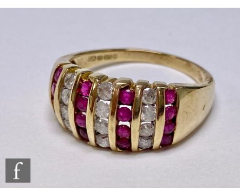 A 9ct hallmarked ruby and diamond ring comprising seven alternative rows of four vertically set stones, weight 5g, ring size 