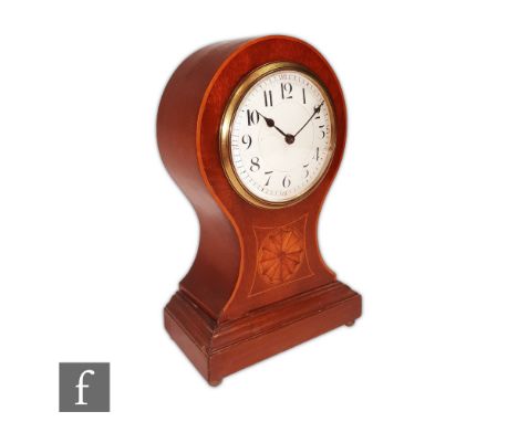 An Edwardian inlaid balloon shaped mantle clock, white circular dial over a stepped base inlaid with fan paterae, height 22.5