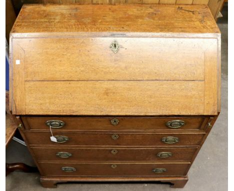 A George III oak bureau, the hinged fall above four graduated drawers, on bracket feet, 93cm wide.
