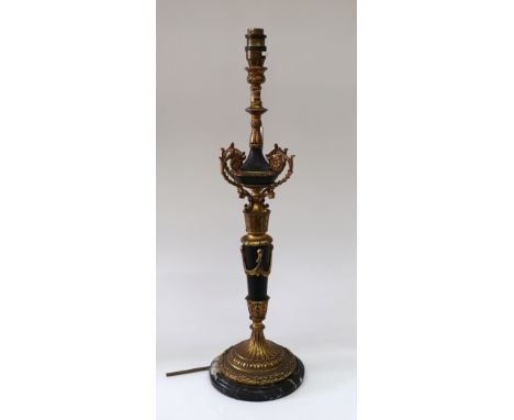 An Empire style gilt metal and Japanned table lamp, second half 20th century, on grey veined marble circular base, 58cm high 