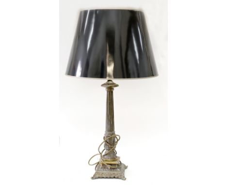 A reproduction gilt metal table lamp, in classical style, with shade.
