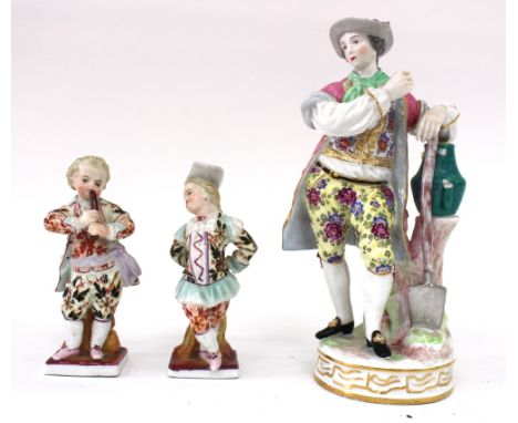 A pair of small continental porcelain figures, one playing a pipe, the other dancing, each 11cm high together with a German p