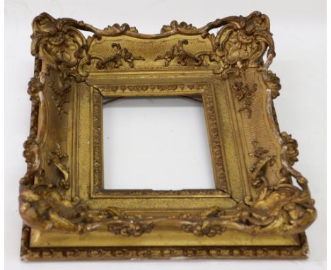 An ornate gilt gesso picture fame, first half 19th century, foliate decorated, sight size 13.5 x 11.5cm.