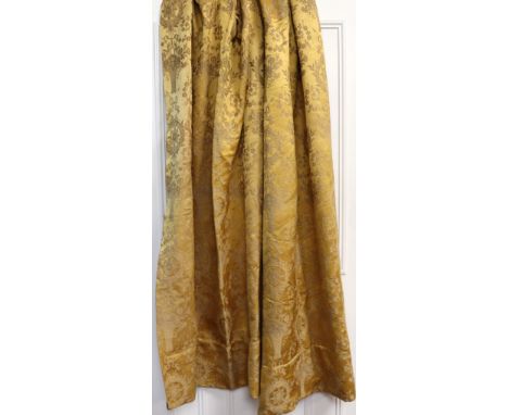 A pair of old gold brocade curtains, second half 19th century, embroidered with a repeated design of baskets of flowers, flor