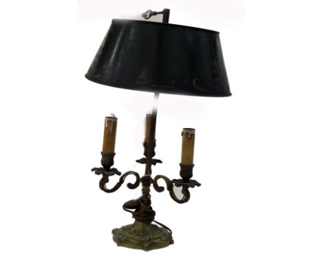 A Louis XVI style gilt metal three - light bouillotte lamp, circa 1900, with leaf scroll cast branches, on a stepped spreadin
