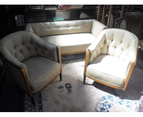 A PAIR OF 1920's FRENCH BIRCH FRAMED TUB CHAIRS WITH EBONISED REEDED LEGS, a pair of matching side chairs, and a similar sofa