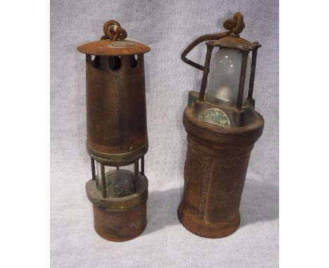 A VINTAGE MINER'S LAMP, with brass label "335" and a "Concordia Electric Safety Lamp" (2)
